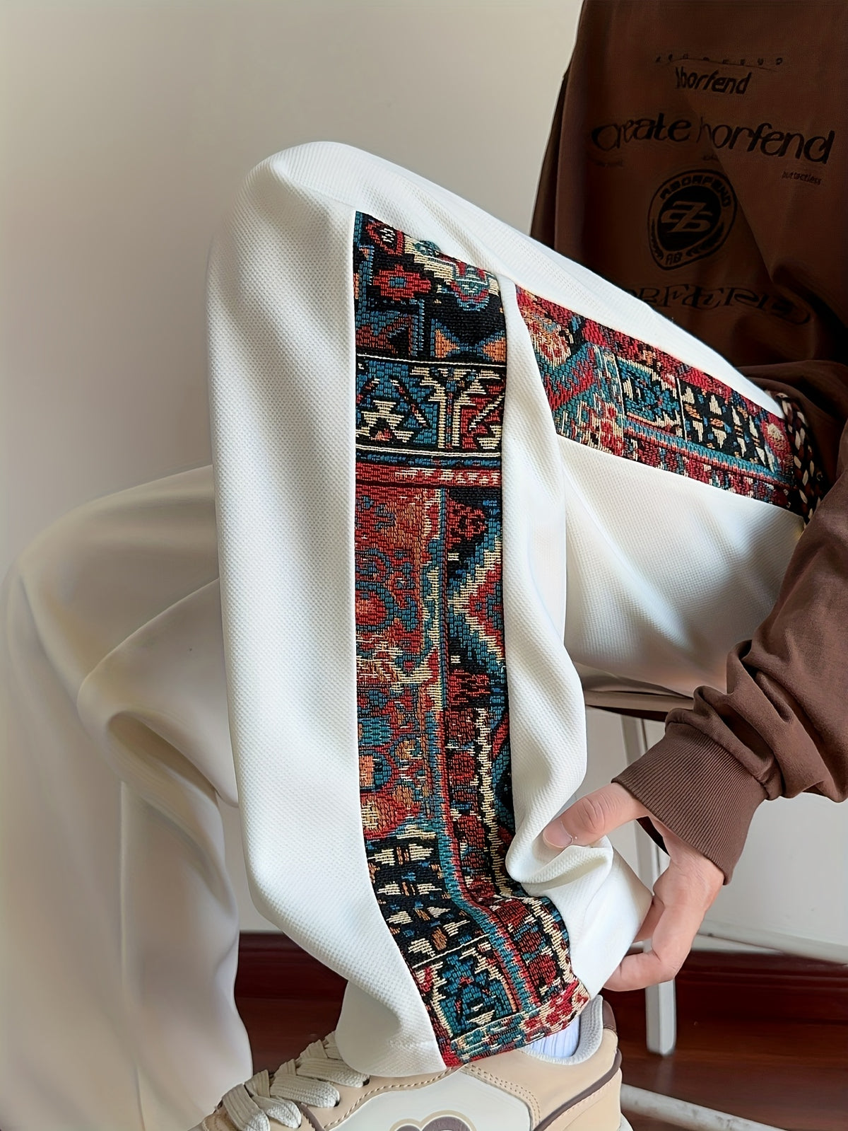 Men's Tribal Embroidery Printed Joggers with Elastic Drawstring Waist, Totem Embroidered Casual Pants Suitable for Autumn and Winter Seasons. Hand Wash Only, Non-stretch Fabric. Features Vintage Totem Side Stripes and Tassel Drawstring for a